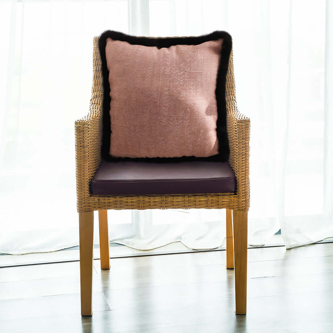 Affordable homewares - Quality woven chair with a stylish cushion, offering great value furniture for any modern home.