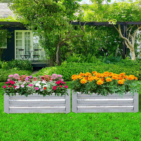 Affordable quality homewares plant boxes with vibrant flowers placed in a lush green garden adding value to outdoor furniture.