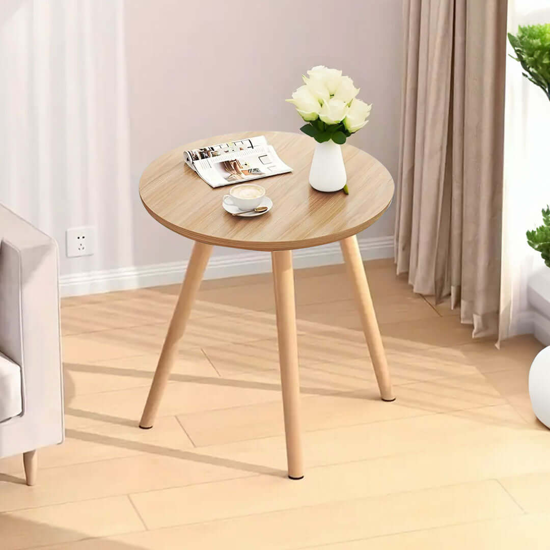 Affordable quality wooden round table with a vase, notebook, and coffee cup, ideal value furniture for homeware décor.