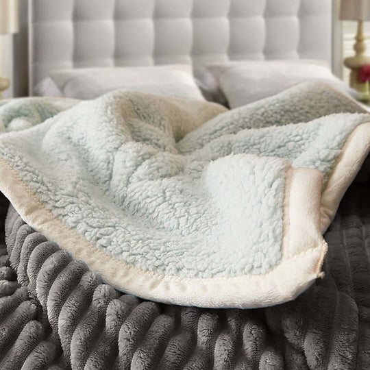 Cozy fleece blanket on bed in modern bedroom, showcasing affordable homewares and quality value furniture.