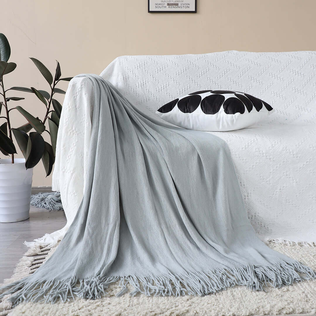 Affordable quality homewares - stylish light grey throw on value furniture couch.