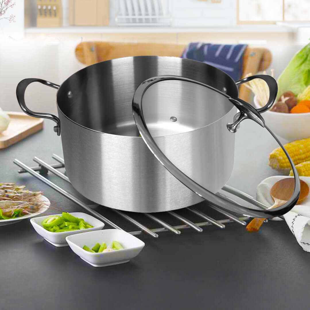 High-quality stainless steel cookware on kitchen counter with fresh ingredients, showcasing affordable homewares and value furniture.