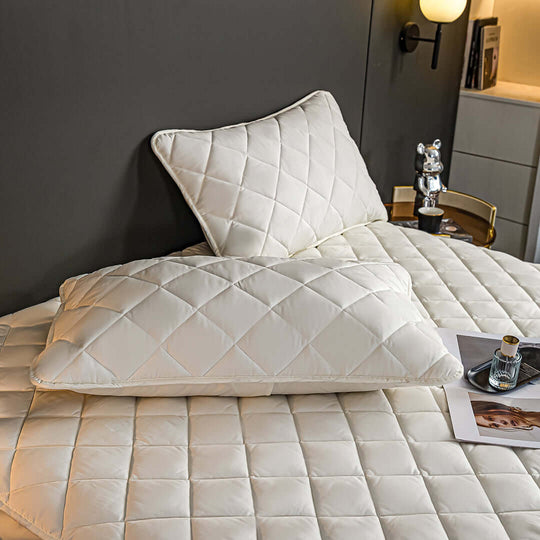 Affordable homewares quality value furniture - quilted white bedspread and pillows in modern bedroom setting