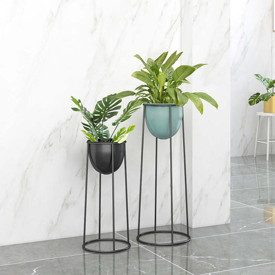 Affordable quality homewares - two value furniture tall metal plant stands with green plants.