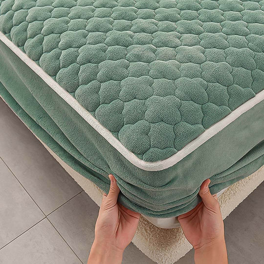 Hands adjusting affordable quality mattress protector for value furniture and homewares.