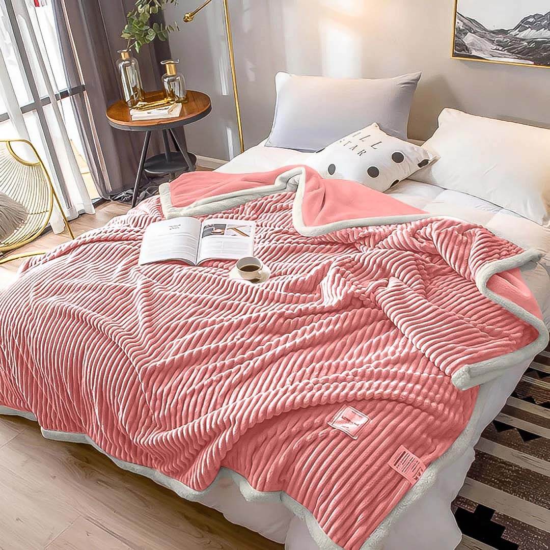 Cozy bedroom with a pink and white striped blanket, showcasing affordable quality homewares and value furniture.