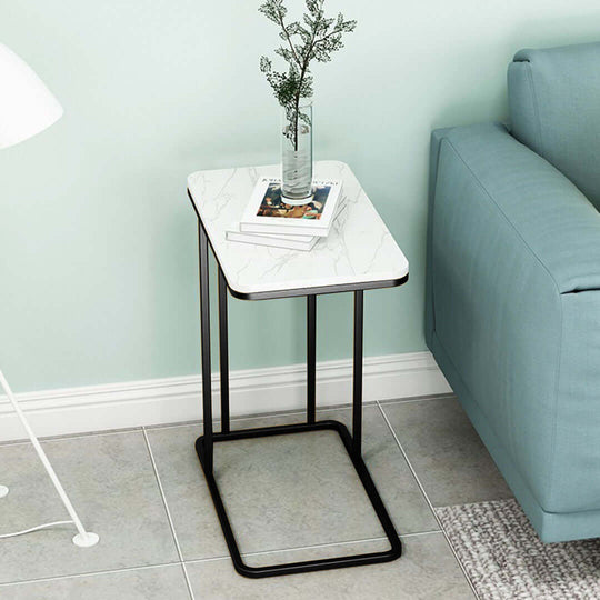 Affordable quality homewares side table with white marble top and black metal frame next to blue sofa, emphasizing value furniture options.