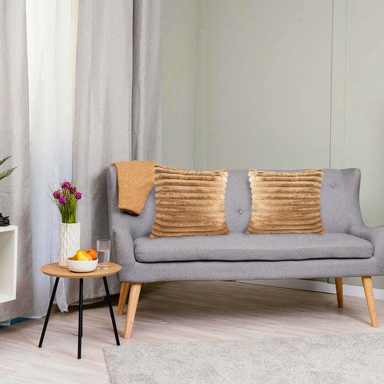 Stylish and affordable homewares including a quality grey sofa with cushions and value furniture enhanced by elegant decor.