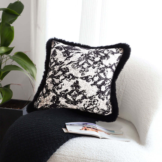 Modern decorative pillow with black and white lace design on a cozy chair, showcasing affordable, quality homewares and value furniture.