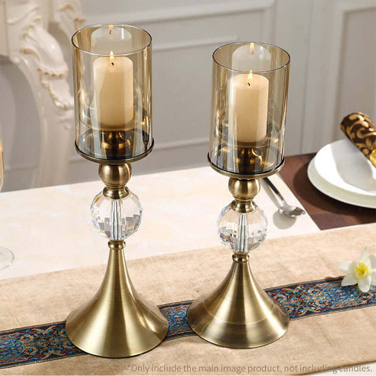 Elegant brass and glass candle holders with lit candles, ideal for affordable homewares and quality value furniture settings.