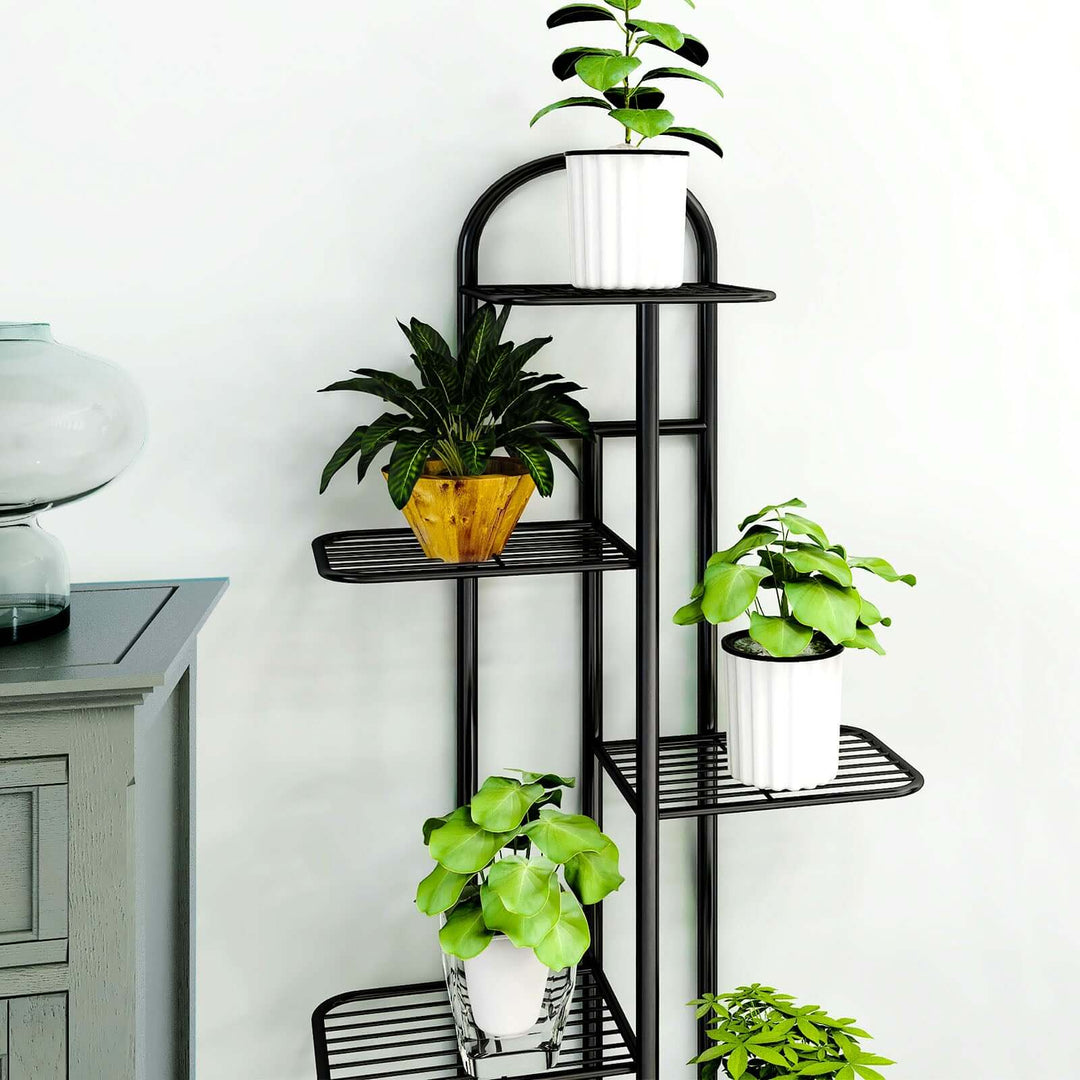 Affordable quality homewares: Stylish metal plant stand with green plants in white pots, showcasing value furniture for indoor spaces