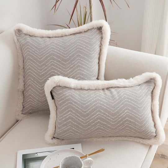 Affordable quality homewares featuring cozy grey cushions with white trim, perfect for adding value to your furniture and living space.