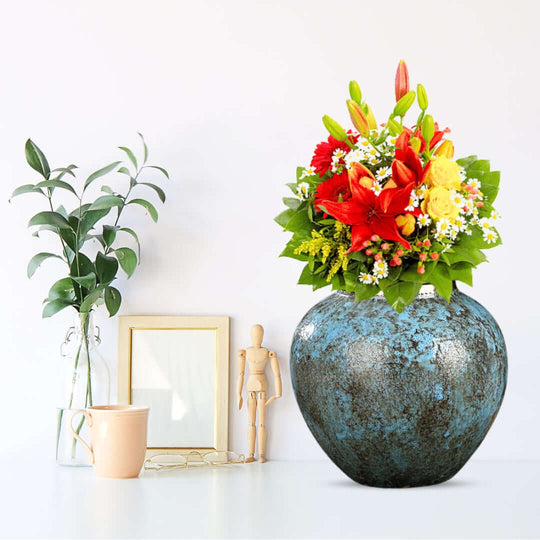 Beautiful floral arrangement in a textured vase showcasing affordable quality homewares and value furniture.