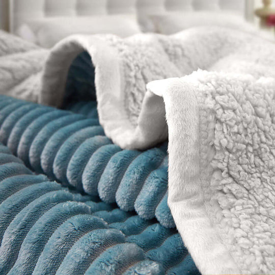 Affordable, high-quality homewares featuring a plush, blue and white textured blanket offering great value and comfort.