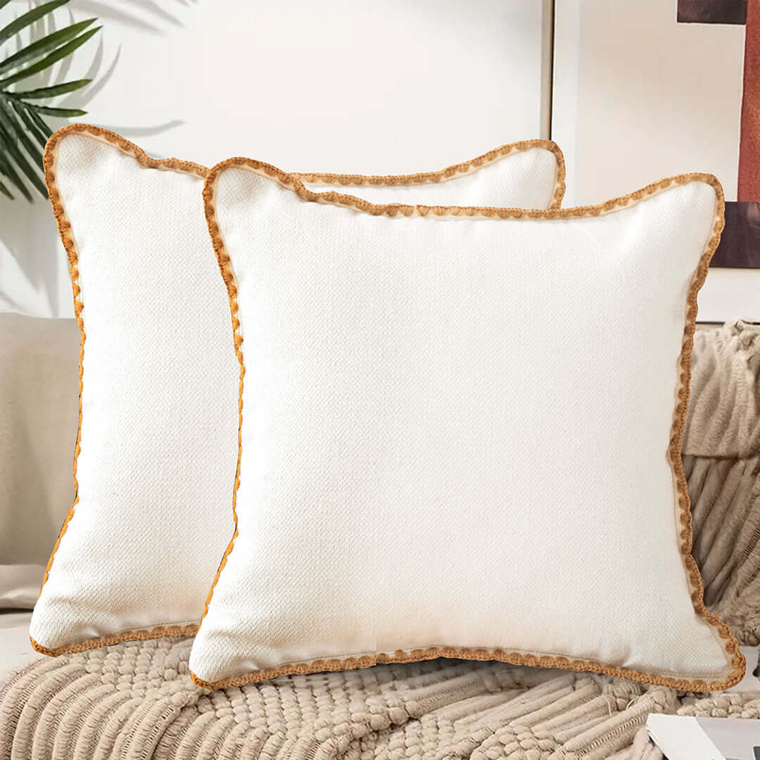 Affordable quality homewares - white decorative pillows with textured detailing.