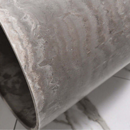 Close-up of a textured, rolled grey stoneware homeware, representing affordable and quality value furniture.