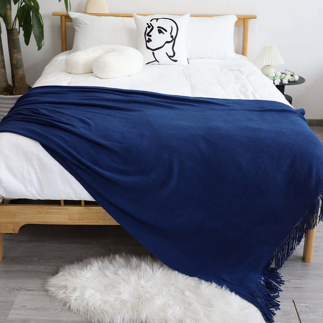 Affordable quality homewares and value furniture - stylish bedroom with wooden bed frame, navy blue blanket, and contemporary decor.