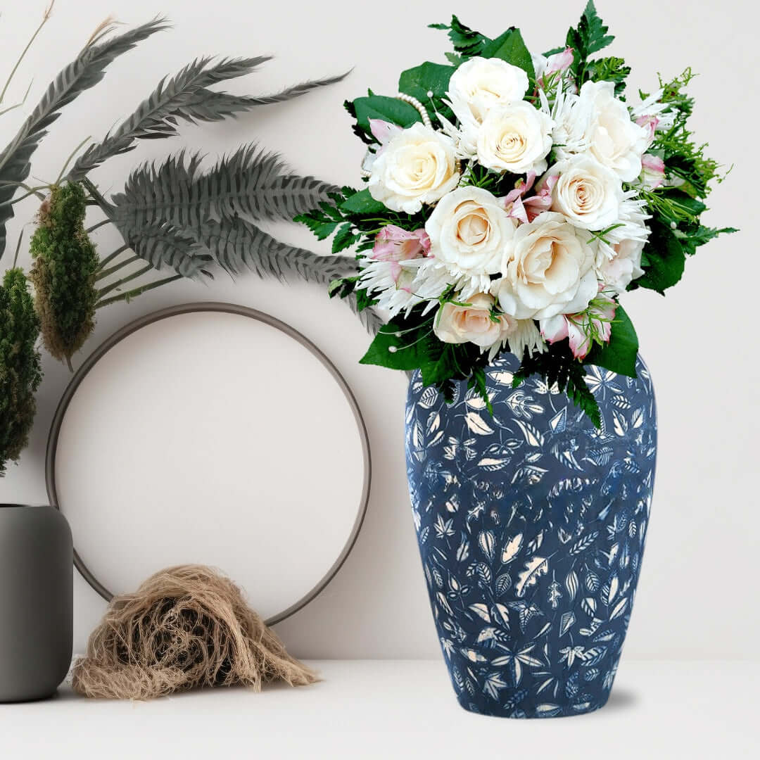 Blue floral vase with white and pink flower arrangement displayed with stylish homewares, offering affordable, quality, and value furniture.