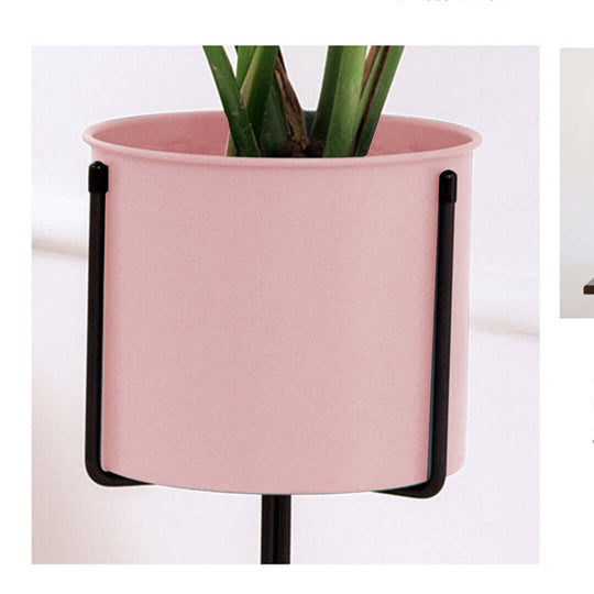 Affordable pink plant pot on black stand for home décor – quality and value furniture accessory.