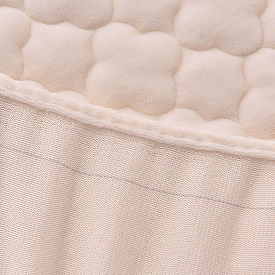 Close-up view of a textured fabric pattern in beige tones, showcasing quality homewares for an affordable price.