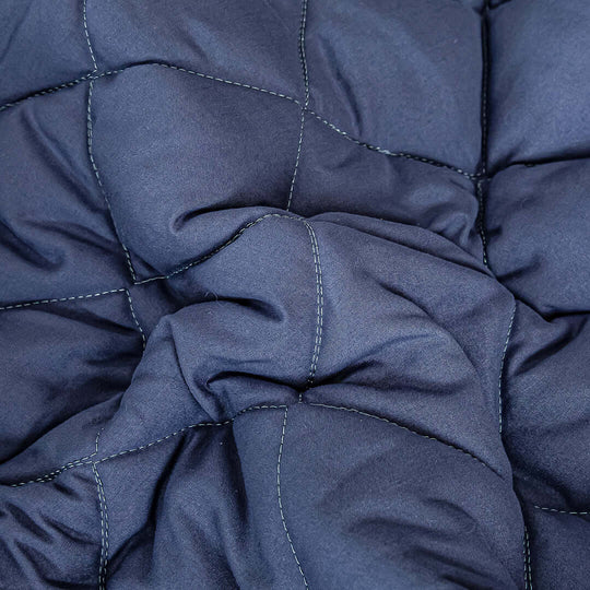 Affordable high-quality dark blue comforter with visible stitching, providing excellent value for homewares and cozy furniture essentials.