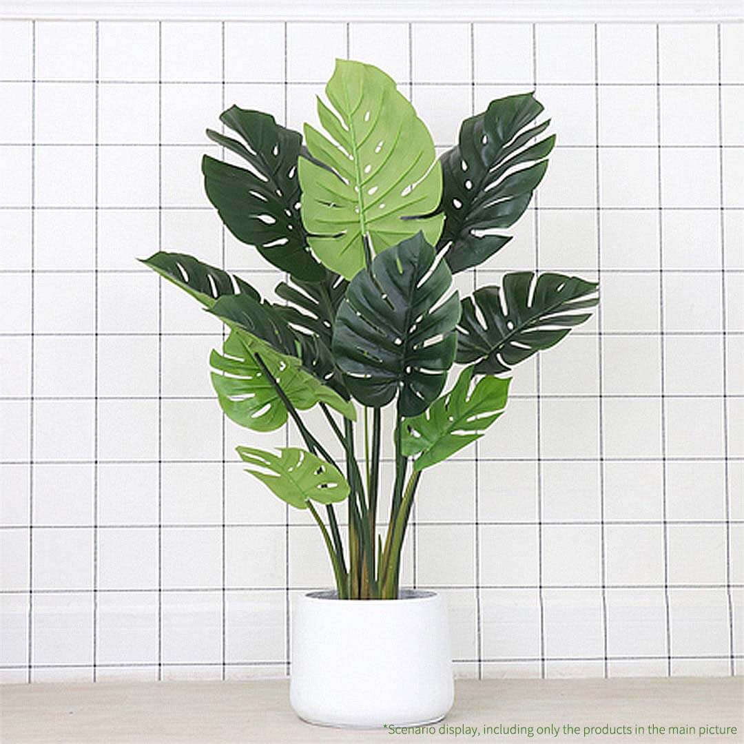 Affordable quality homewares - Faux monstera plant in white pot against tiled wall backdrop. Enhances value furniture decor.