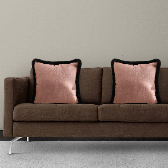 Affordable quality homewares - brown sofa with value furniture and two pink cushions.