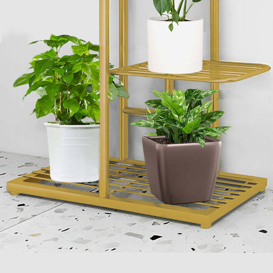 Affordable quality homewares featuring green potted plants on a stylish gold value furniture plant stand.