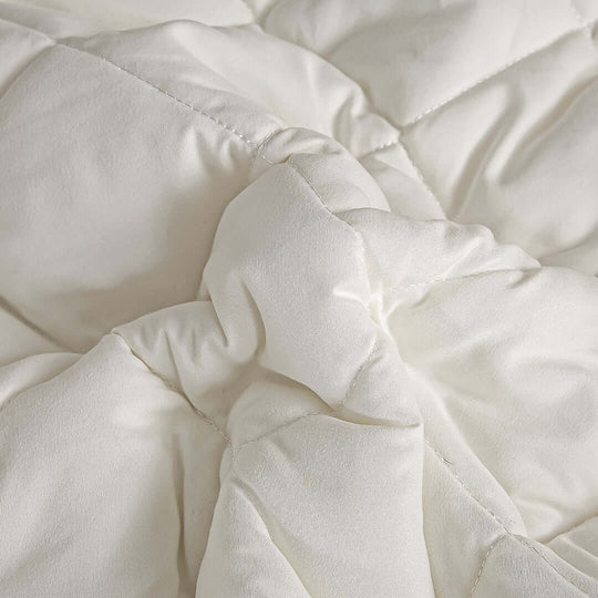 High-quality white quilt showcasing plush, affordable homewares offering superior comfort and value furniture.