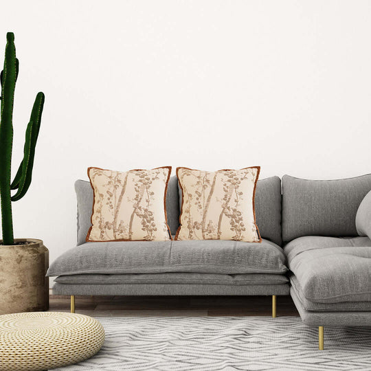 Affordable quality homewares - modern grey sofa with decorative pillows and a cactus plant - value furniture for stylish living rooms.