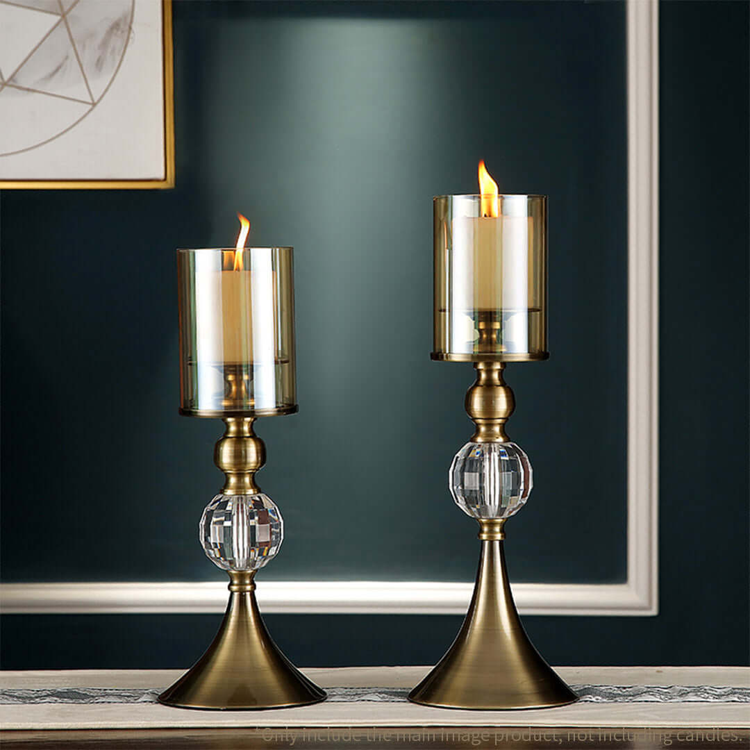 Elegant brass and glass candle holders on a table, showcasing affordable and quality homewares for adding value furniture to any home.