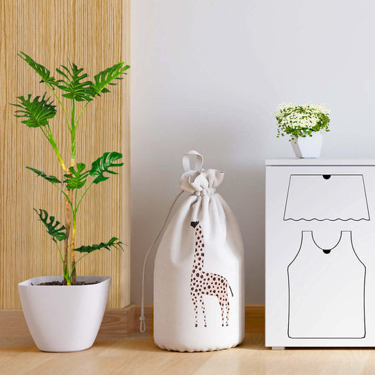 Stylish, affordable homewares including a quality plant, decorative giraffe bag, and value furniture near a white cabinet.