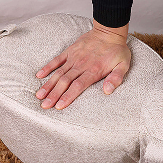 Hand pressing comfortable cushion showcasing affordable quality value furniture and homewares.