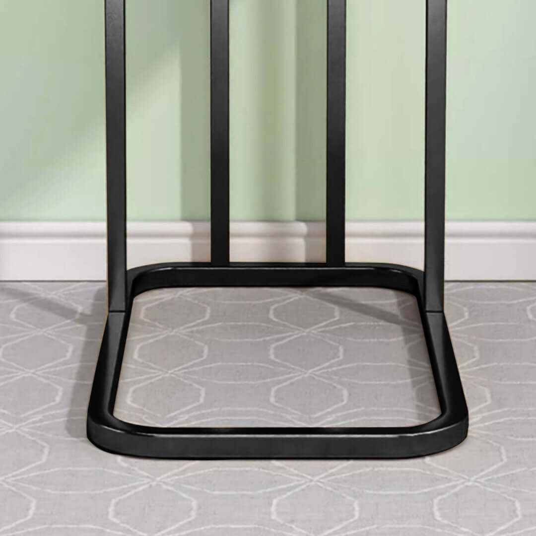 Modern black metal table legs on a patterned grey rug highlighting affordable and quality homewares for value furniture.