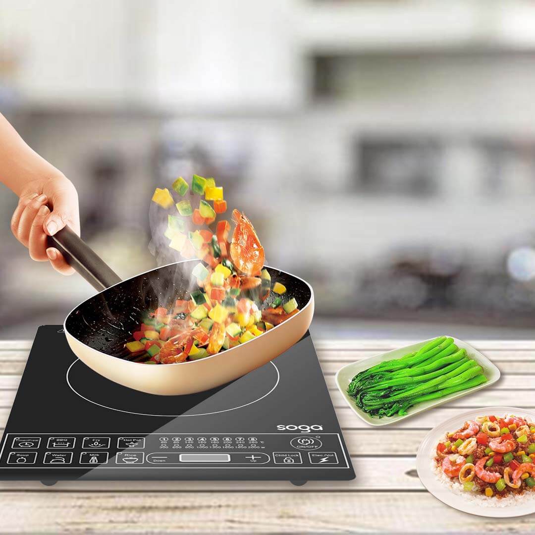 Cooking fresh vegetables on an electric stovetop with a non-stick frying pan, featuring affordable and quality homewares for value.