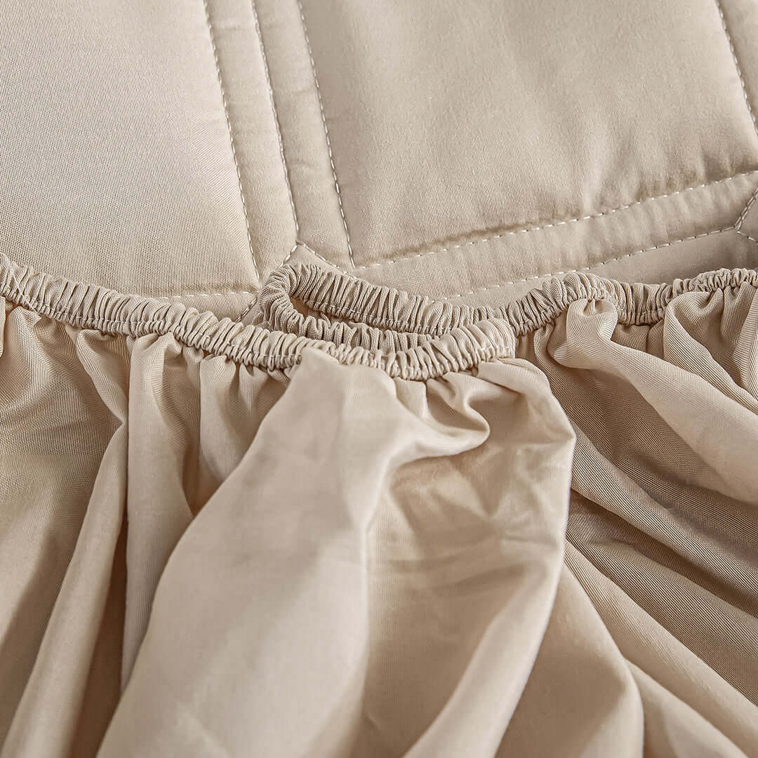 Beige quilted bedding with gathered fabric detail, showcasing affordable and quality homewares for value furniture.