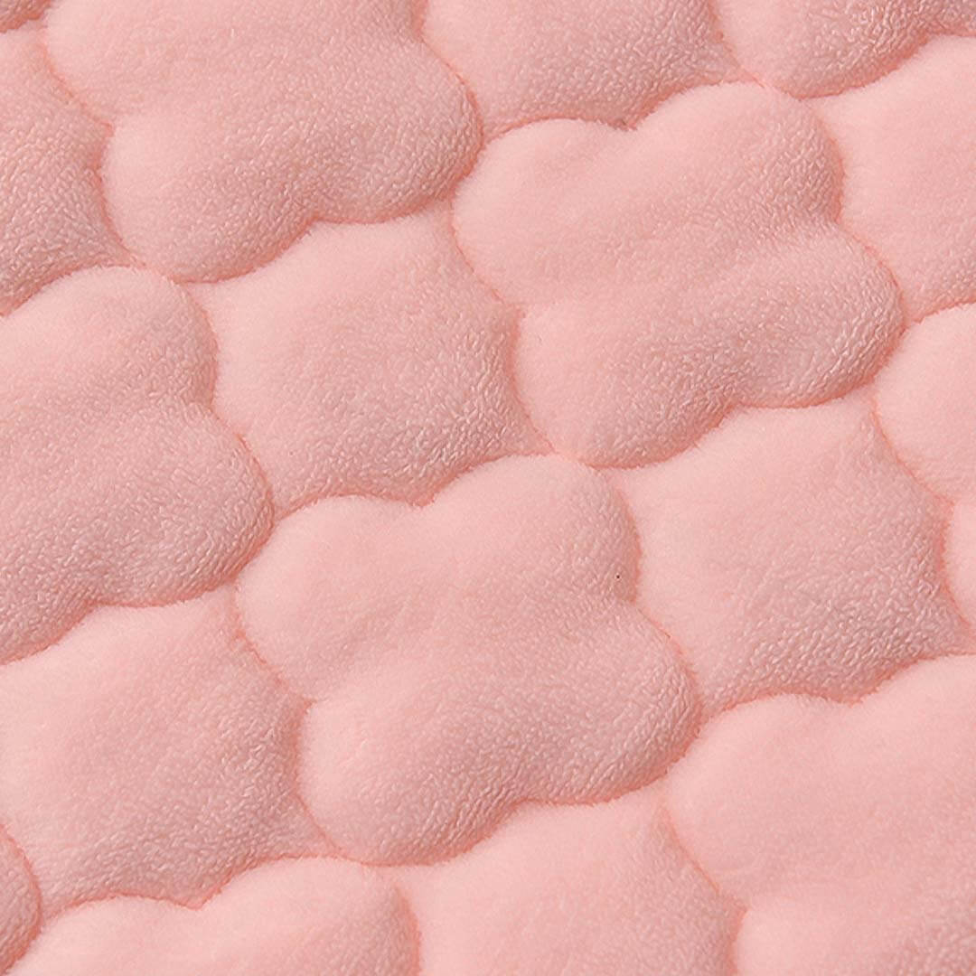 Close-up of soft pink textured fabric in cloud shapes, representing affordable quality homewares and value furniture.