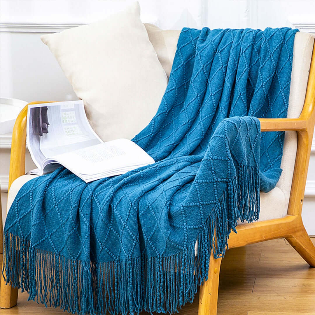 Affordable quality blue throw blanket on wooden chair, perfect for home comfort and value furniture decor.