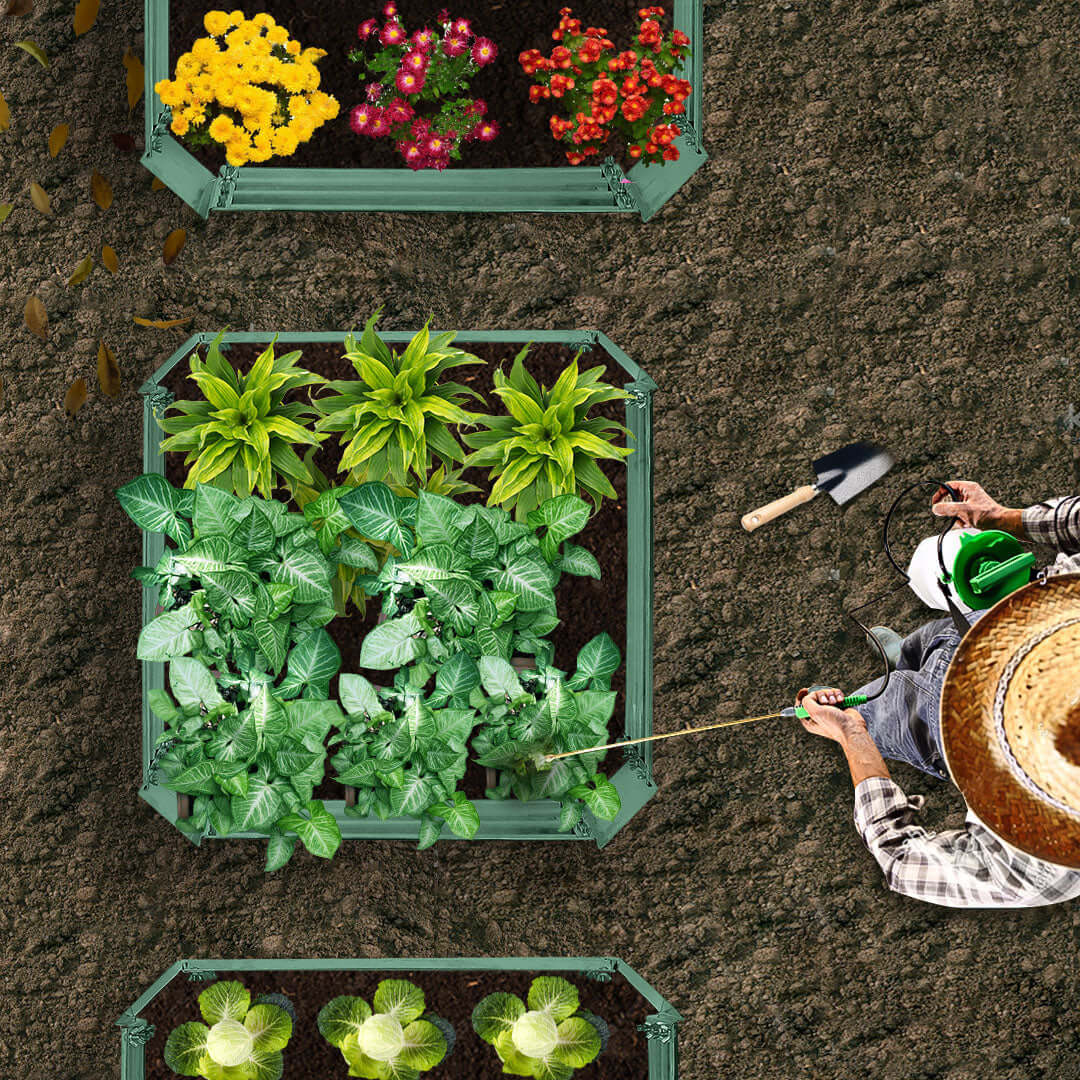 Overhead view of a gardener working on raised garden beds with various vegetables and flowers.