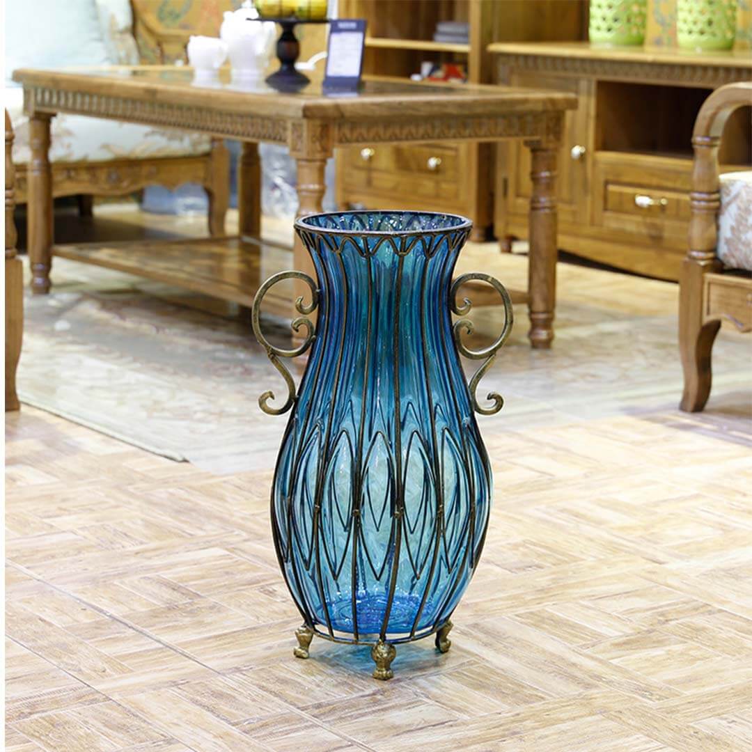 Affordable homewares include this quality blue glass vase with metal accents, adding value and elegance to your furniture collection.