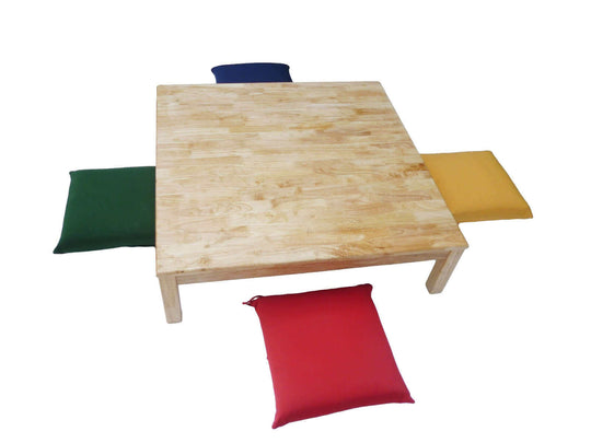 Square low table with colorful outdoor cushions for kids' play, arts and crafts, or as a versatile coffee table.