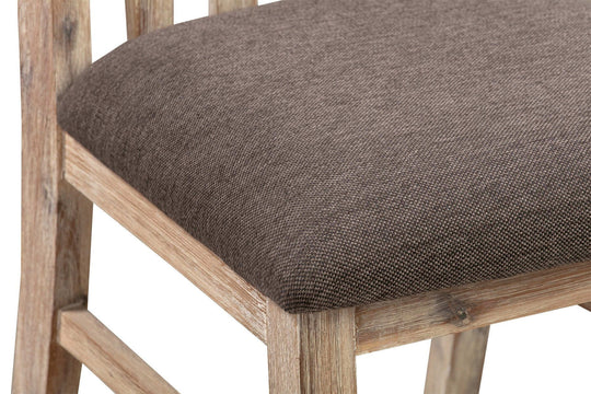 Close-up of Java dining chair seat in oak color with comfortable padded fabric and sturdy acacia wood frame.