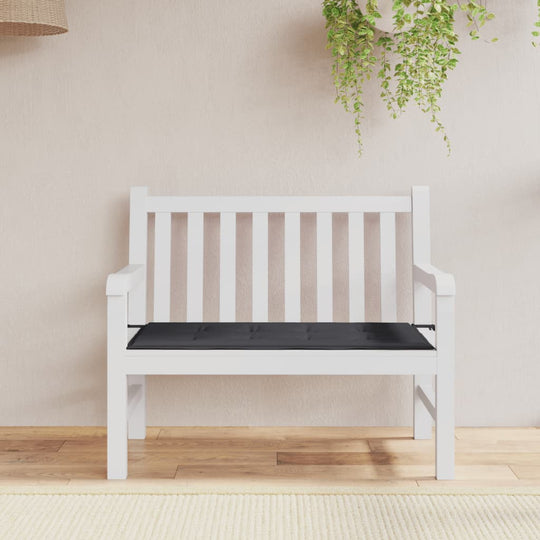 Affordable quality garden bench with black Oxford fabric cushion on a white bench in an outdoor setting.