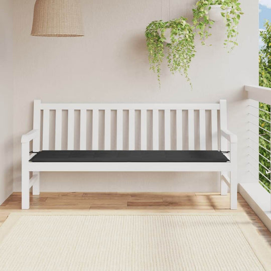 Black garden bench cushion 180x50x3 cm on white wooden bench, outdoor setting with greenery, showcasing affordable quality style.