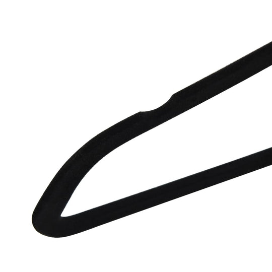 Close-up of an affordable black velvet clothes hanger with anti-slip surface, showing quality design with a groove for secure holding.