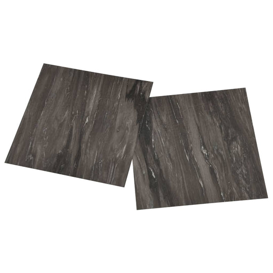 Dark grey self-adhesive PVC flooring planks with natural texture, offering affordable quality and durability.