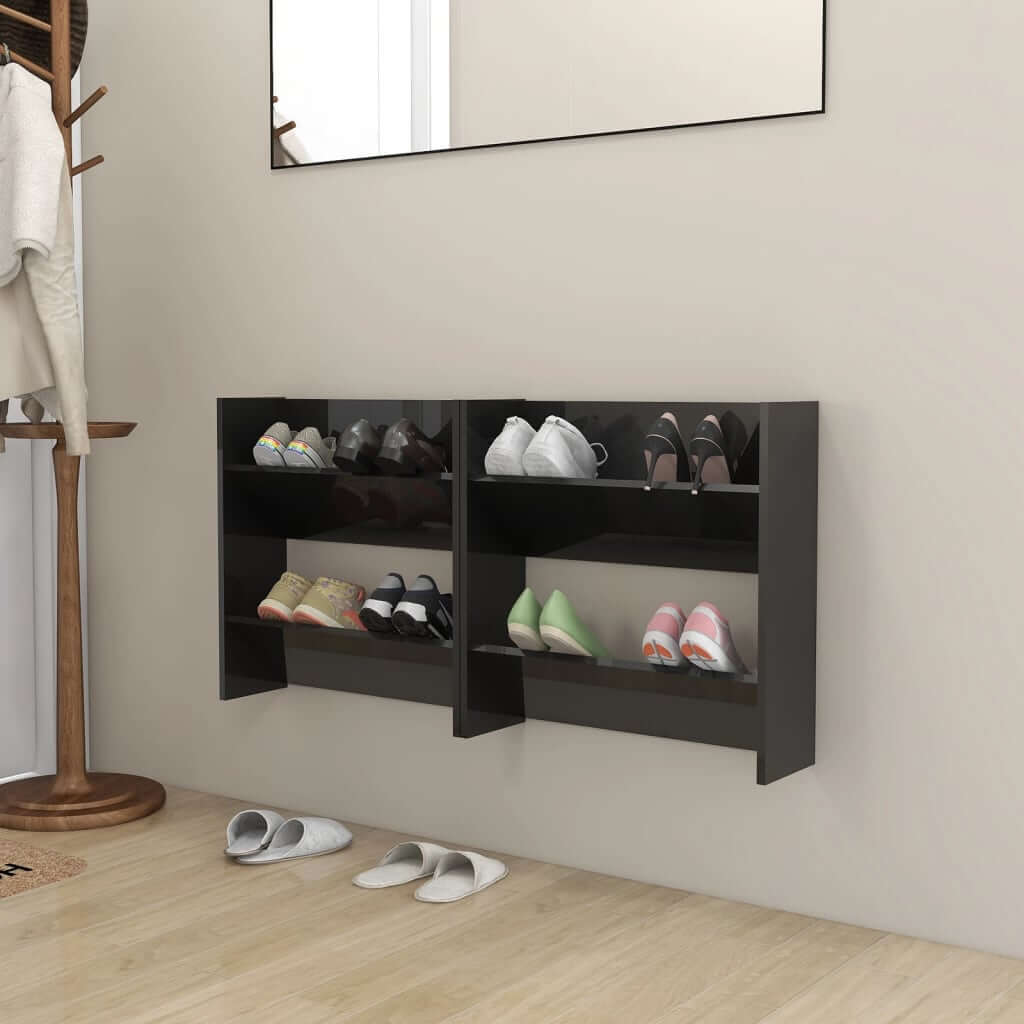 High gloss black wall-mounted shoe cabinets with tipping shelves, showcasing organized footwear in a modern and affordable design.