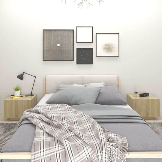 Bedroom with grey bed, plaid blanket, and bedside cabinets in Sonoma oak, featuring wall art and a desk lamp for a cozy, organized space.