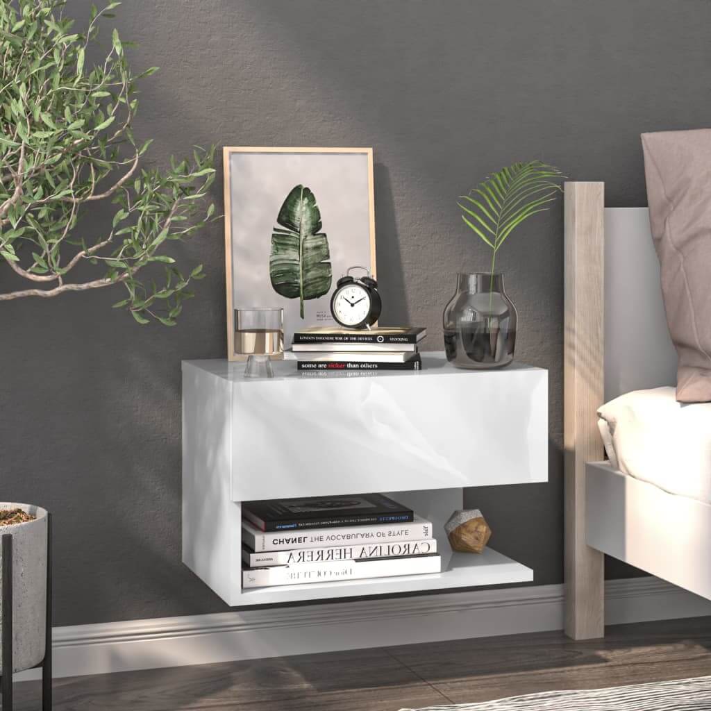 Wall-mounted white bedside cabinet with books, decor, and clock in modern bedroom setting showcasing affordable and quality furniture.