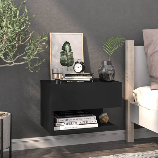 Affordable quality wall-mounted black bedside cabinet with books and decor in bedroom for maximized space and cleanliness